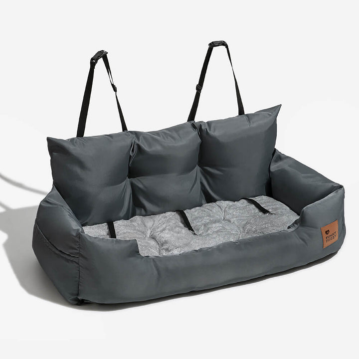 Large dog looking out window from secure waterproof car seat bolster bed
