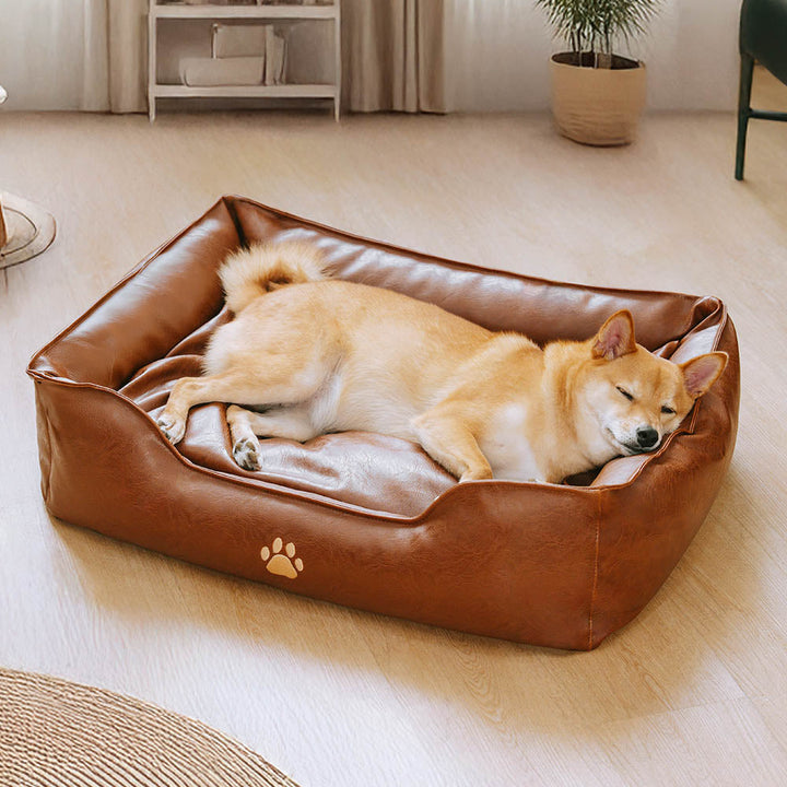 Waterproof faux leather dog sofa bed with plush bolster, durable and washable pet furniture for large dogs