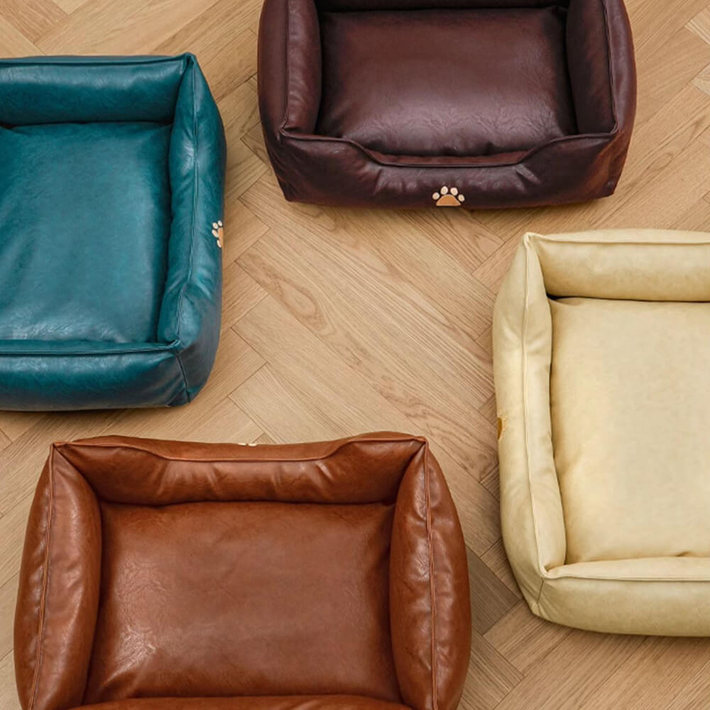 Dog enjoying a cozy sleep on a waterproof faux leather pet sofa bed, comfortable and durable pet furniture