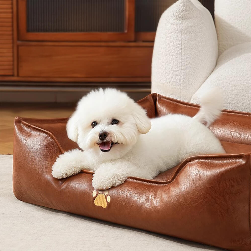 Washable waterproof faux leather pet bed, easy-to-clean dog sofa with bolster and sturdy construction