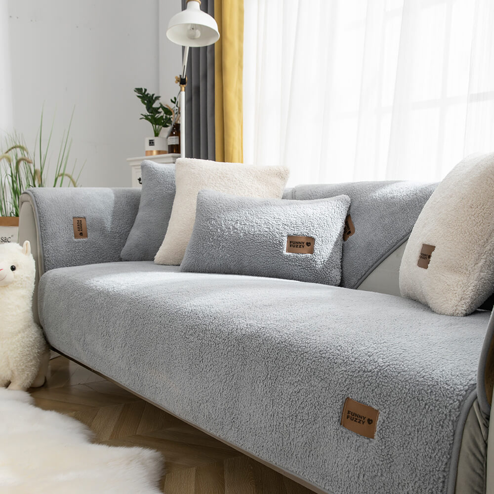 Sectional sofa protector with waterproof sherpa fleece, featuring anti-slip backing for pet safety