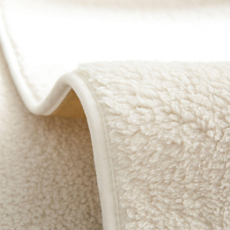 Anti-slip waterproof sherpa fleece couch cover draped over a sectional, ensuring pet-friendly durability