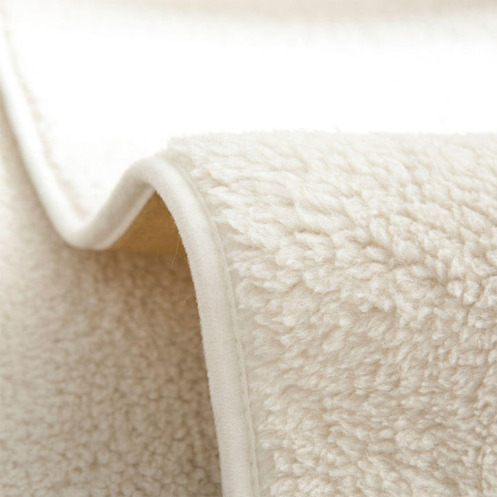 Anti-slip waterproof sherpa fleece couch cover draped over a sectional, ensuring pet-friendly durability