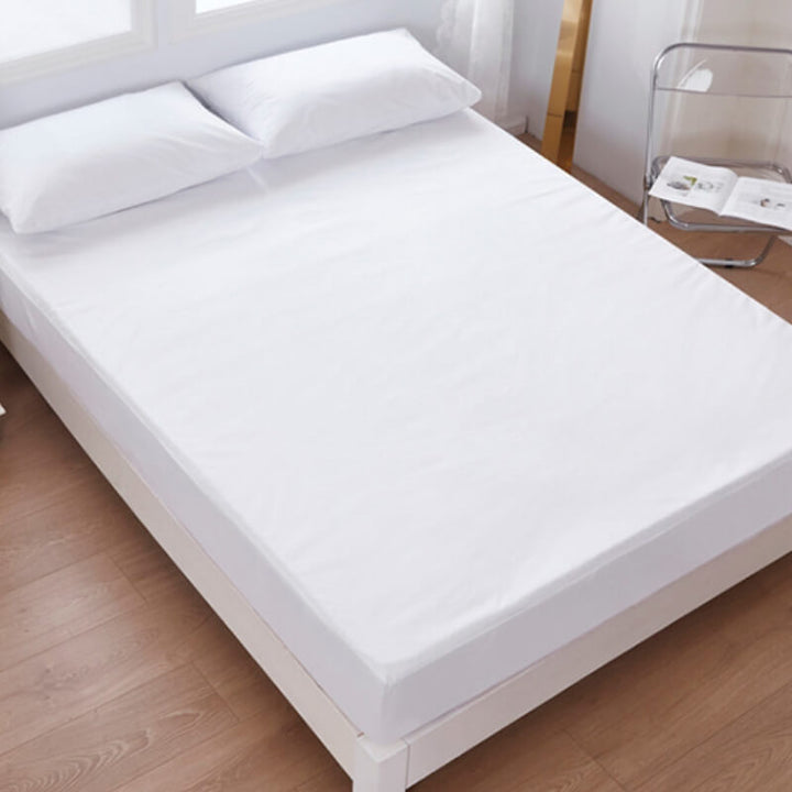 Close-up of the waterproof fitted sheet fabric, showing its skin-friendly texture and durable weave.