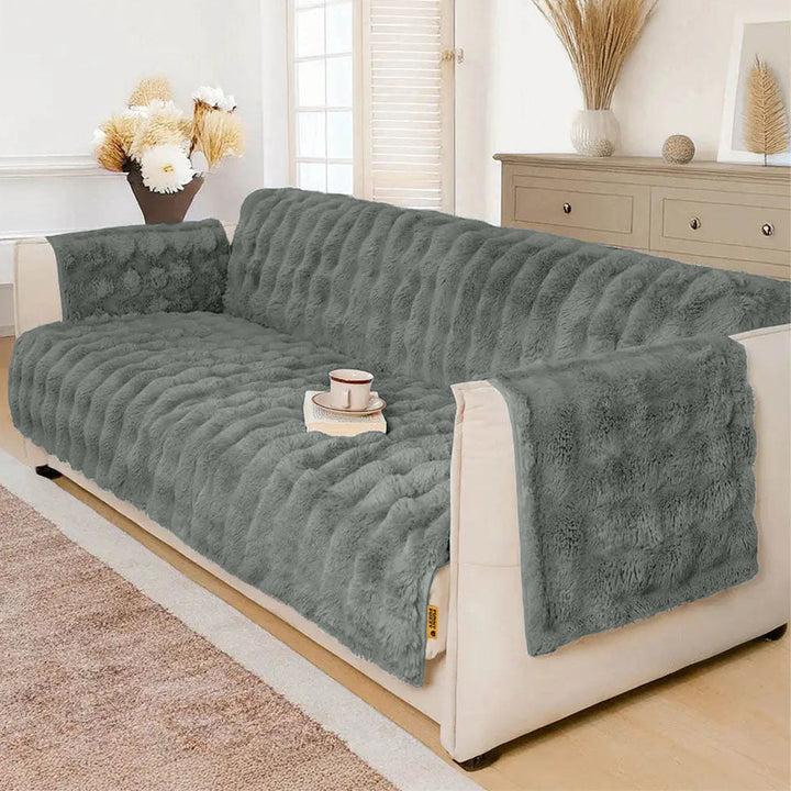 Waterproof fluffy couch cover in light grey, soft, pet friendly sofa protector for living room furniture.