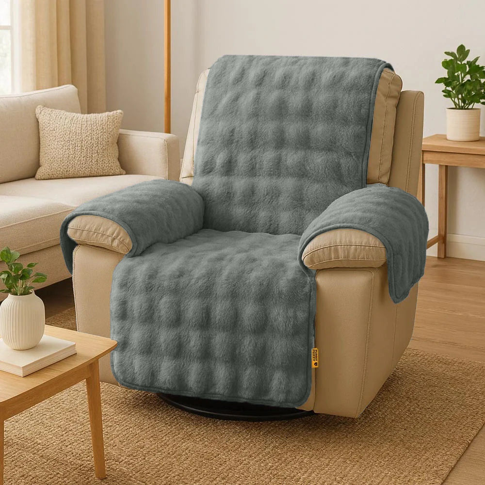 Grey waterproof fluffy couch cover with elastic straps, ensuring a secure fit on sofa.