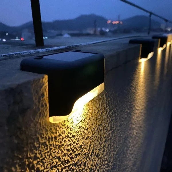 Close-up of a compact waterproof solar LED deck light, easy to install for outdoor ambiance