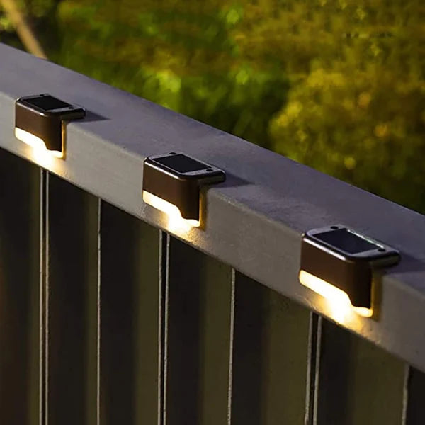 Overview of a backyard with wireless solar deck lights dotting the perimeter for safety and style