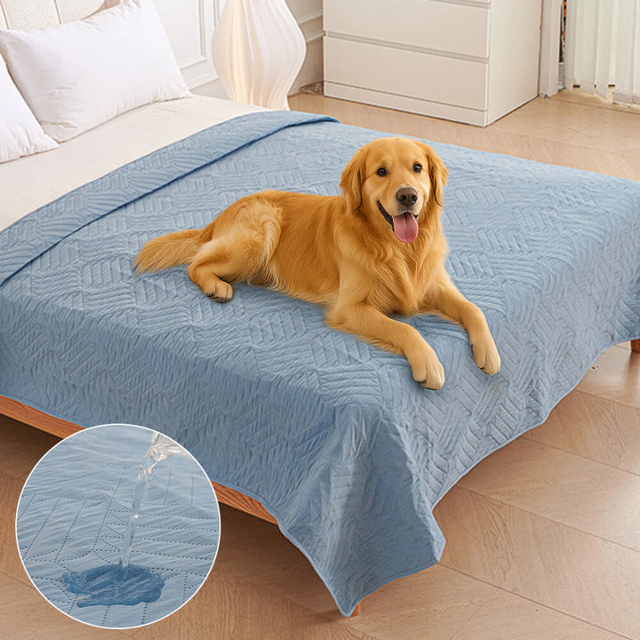Washable pet blanket in neutral tone draped over a bed, perfect for pet-friendly home decor.