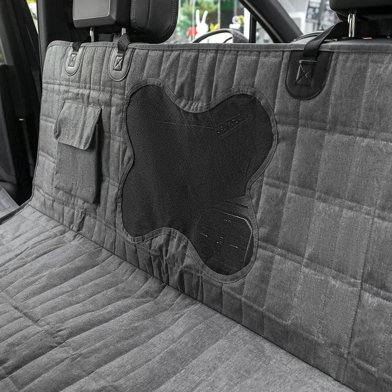 Unisex waterproof dog seat cover for car back seat, offering protection and comfort during pet travel.
