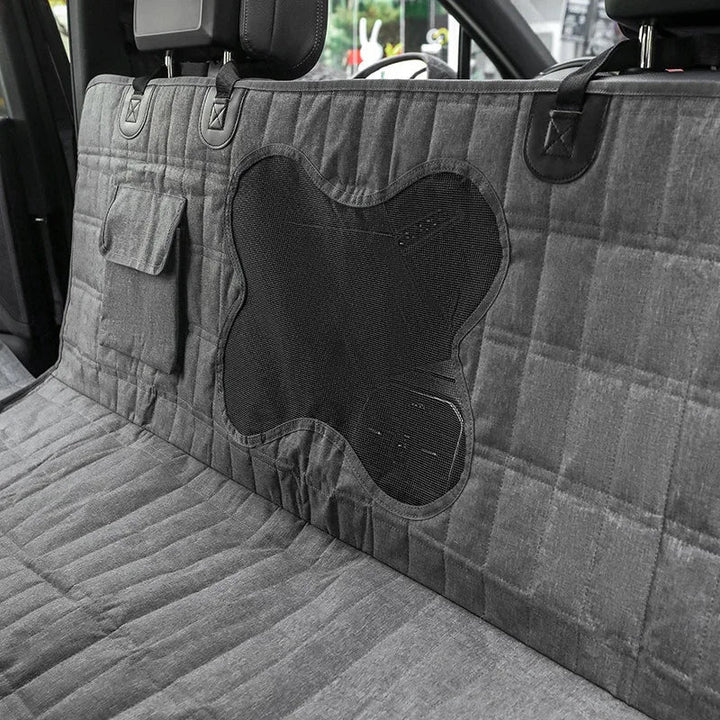 Unisex waterproof dog seat cover for car back seat, offering protection and comfort during pet travel.