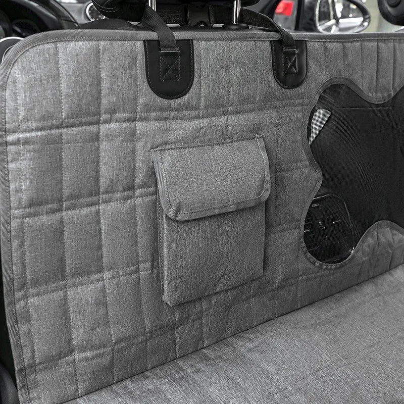 Black pet car seat cover hammock, waterproof and durable, ensures clean back seats during dog travel.