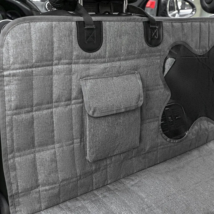 Black pet car seat cover hammock, waterproof and durable, ensures clean back seats during dog travel.