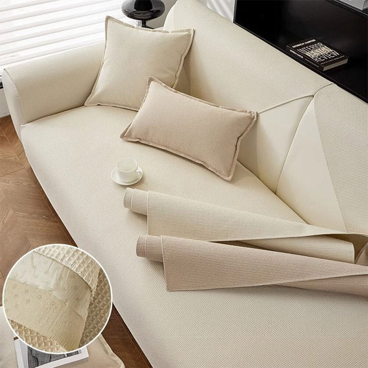 Family dog relaxing on a pet-friendly, non-slip sectional cover, protecting the furniture