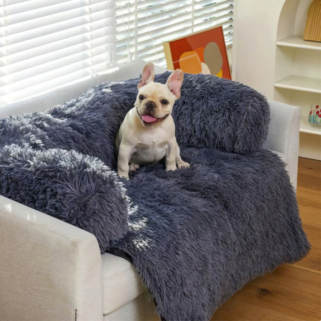 Grey and white plaid waterproof pet blanket draped over an armchair
