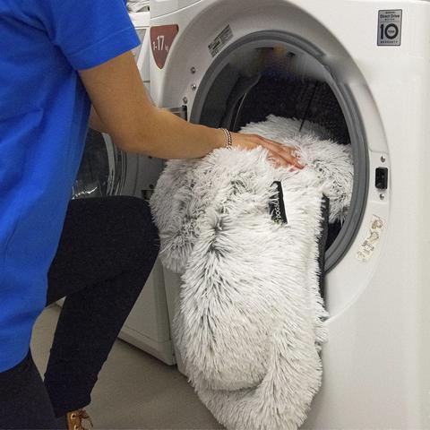 Dog furniture protector blanket, illustrating its waterproof layer and durability