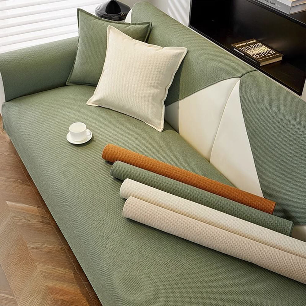 Non-slip waterproof pet sofa protector draped over a brown sectional couch, ideal for furniture protection.