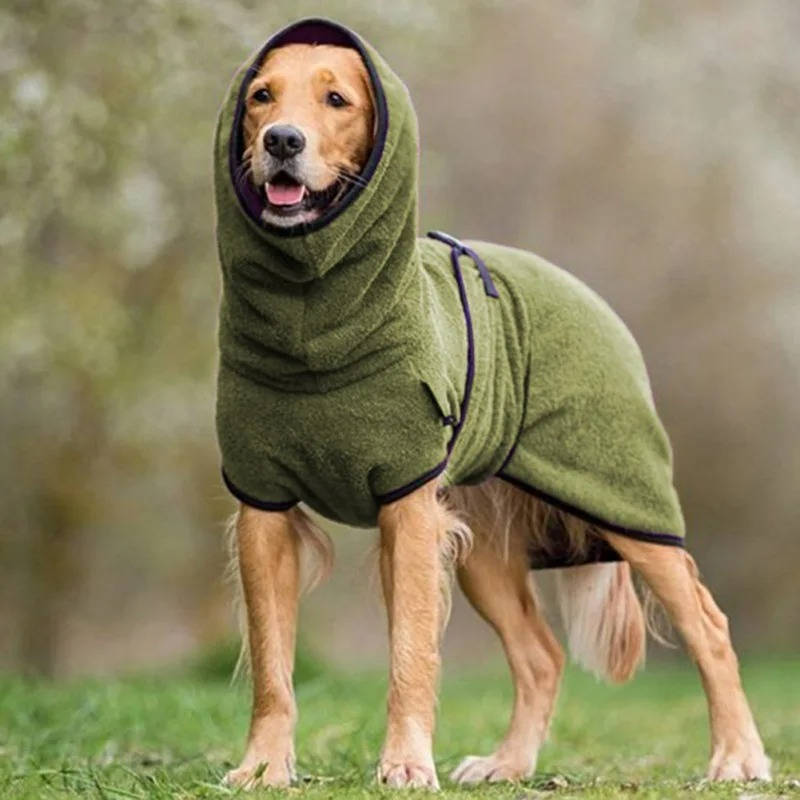Close-up of the durable fabric and reflective detail on a black dog winter coat. Adjustable pet wear.