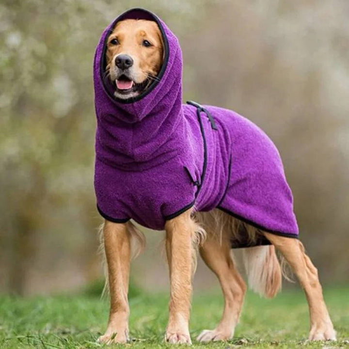 Side view of a dog in a green reflective and waterproof winter pet coat, showcasing adjustable design.