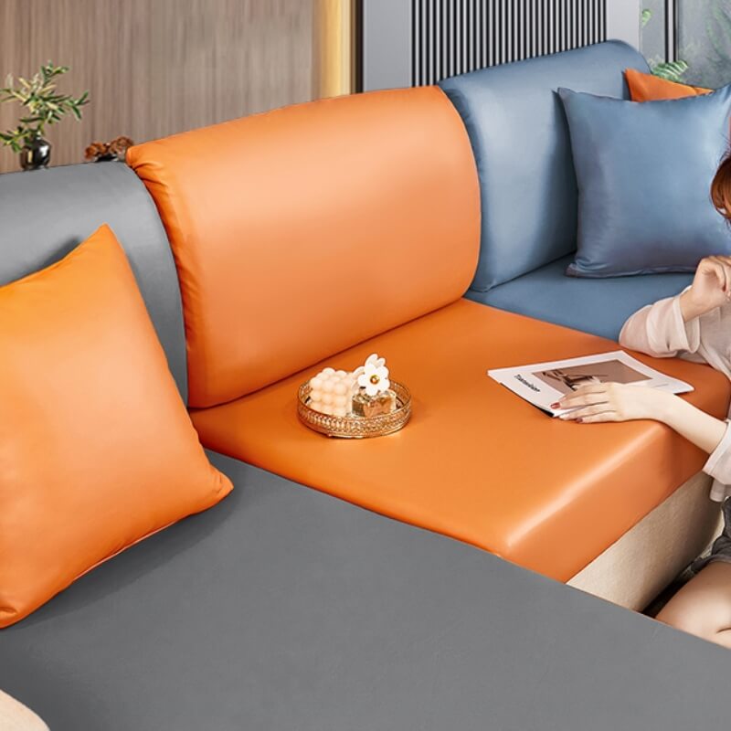 Beige technology fabric couch protector, pet-friendly and easy clean, draped over a living room sofa.