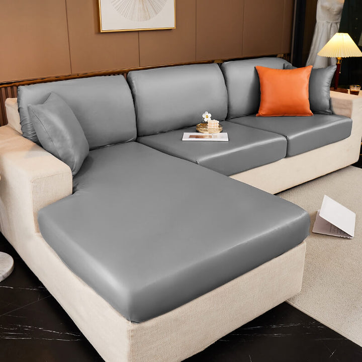 Close-up of the waterproof technology fabric of a sofa protector, highlighting its durable and easy-clean texture.