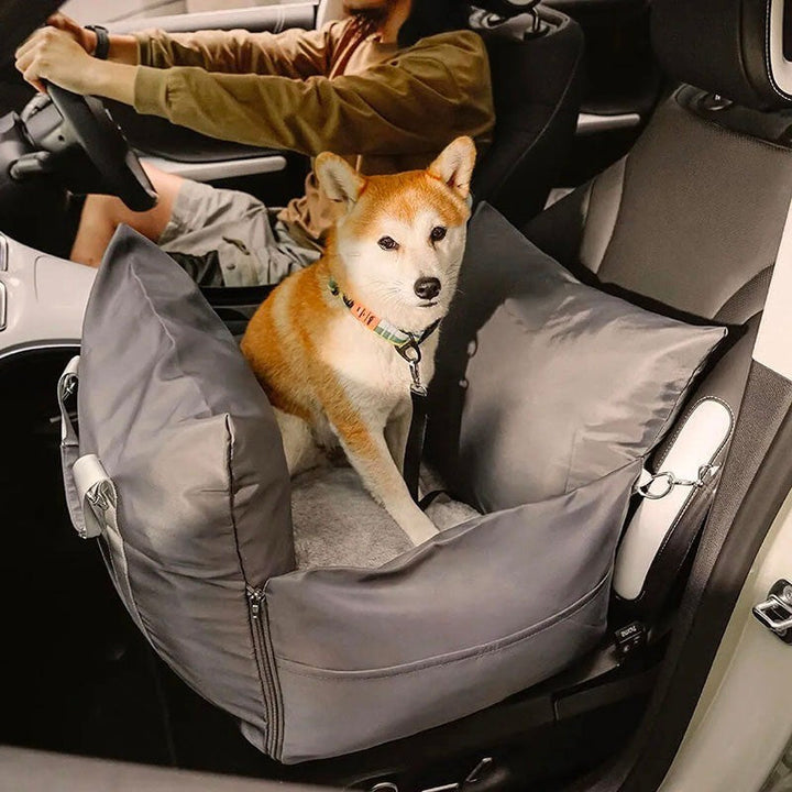 Waterproof travel dog car seat bed, dark grey, with elevated pillow for pet comfort & safety.