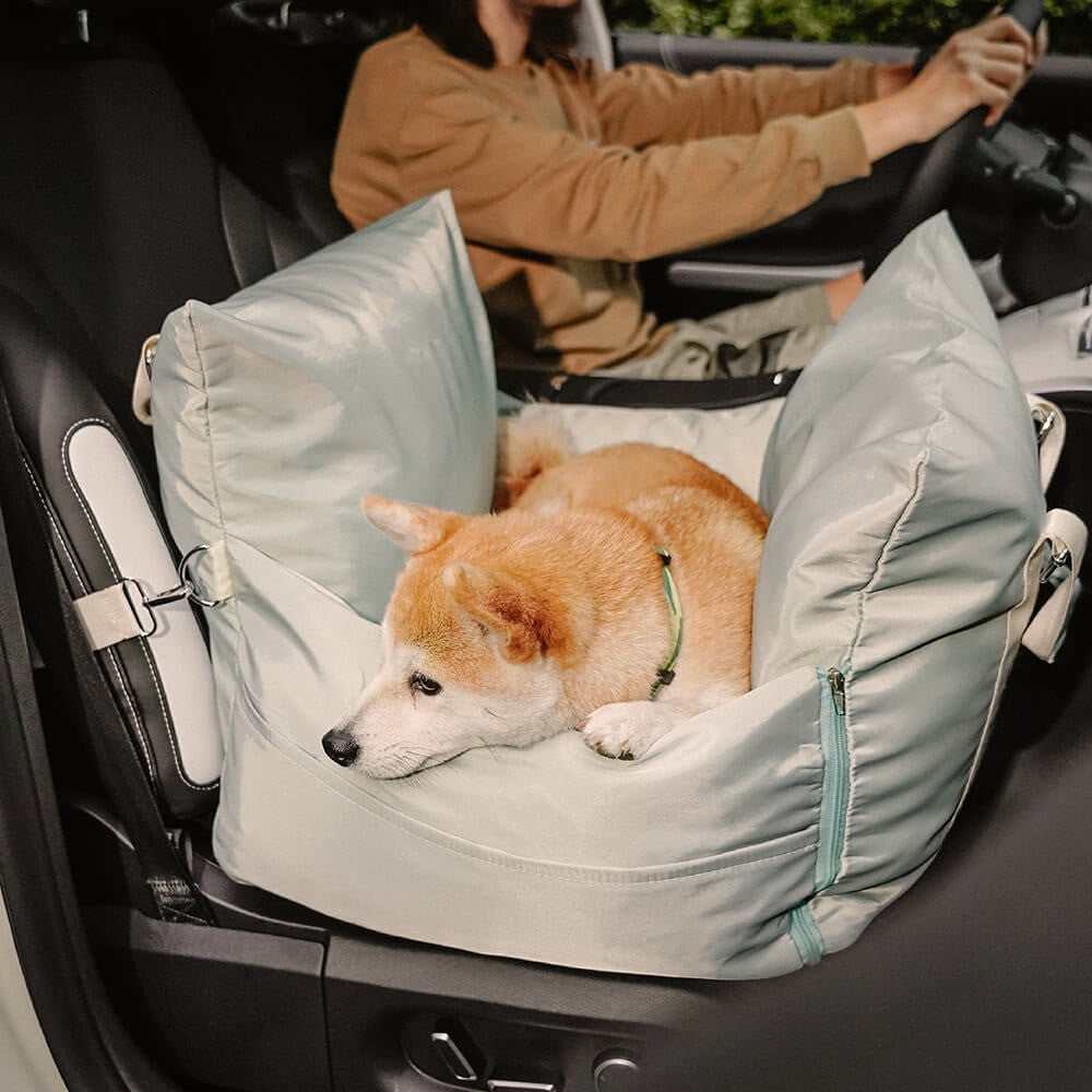 Beige waterproof dog car seat and travel bed, protects vehicle upholstery, with adjustable straps.