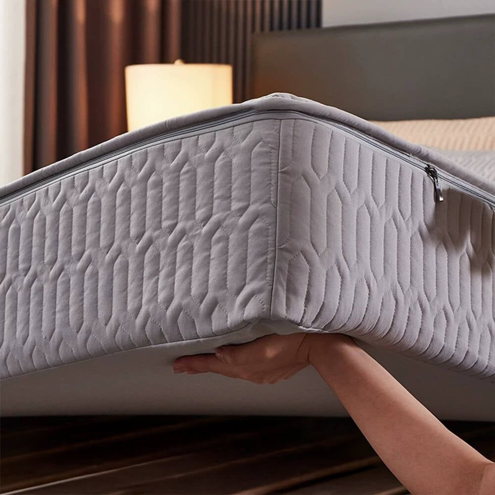 Soy fiber waterproof mattress protector on bed, offering antibacterial and allergy relief