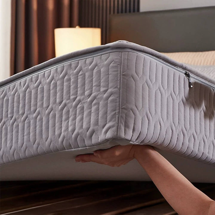 Soy fiber waterproof mattress protector on bed, offering antibacterial and allergy relief
