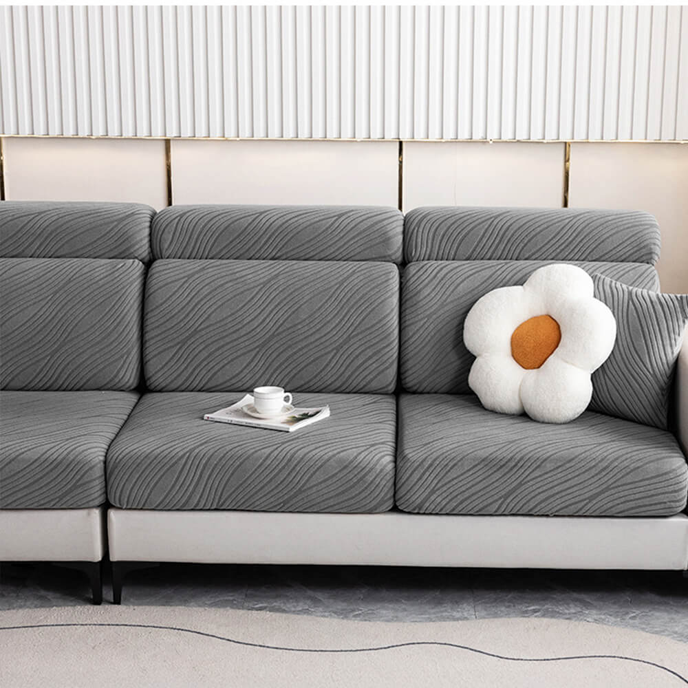Close-up of wave pattern on gray Jacquard stretch sofa cover, full wrap design