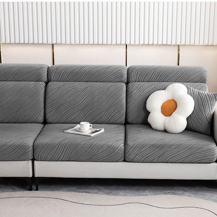 Close-up of wave pattern on gray Jacquard stretch sofa cover, full wrap design