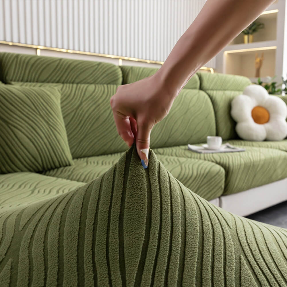 Anti-slip stretch sofa cover in wave jacquard texture, protecting a couch