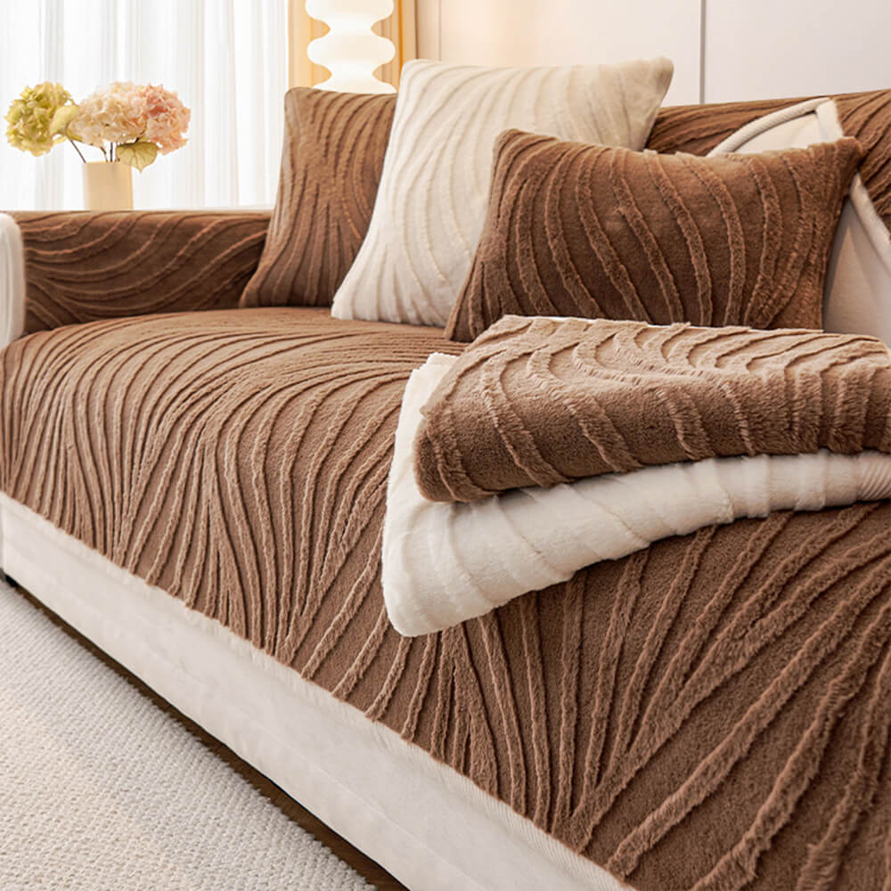 Wave textured plush non-slip sofa cover in beige, protecting furniture from spills.
