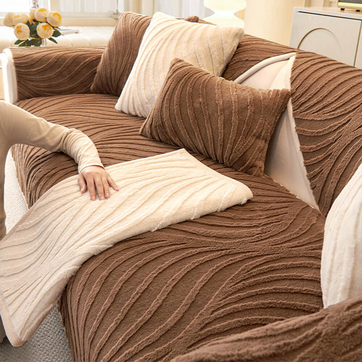 Grey plush non-slip sectional couch cover with a distinct wave pattern, home decor.