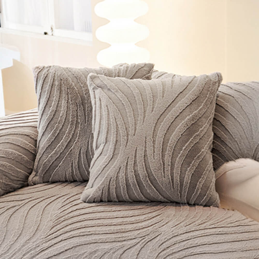 Detail of the wave texture on a plush non-slip sofa cover, soft to the touch.