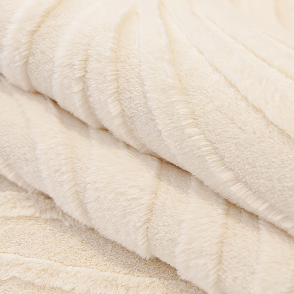 Detail of the non-slip backing on a wave textured plush sofa cover, secure fit.