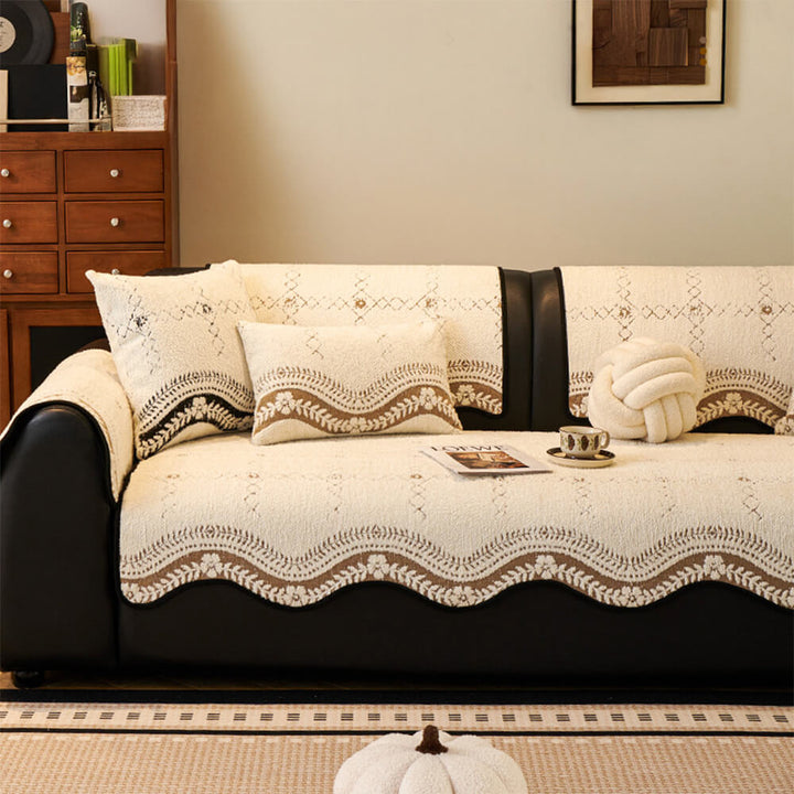 Sectional sofa covered with cream-colored wavy plush protector, ideal for pets