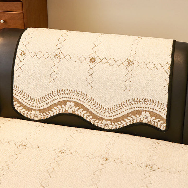 Corner of a sectional sofa with a dark grey wavy plush anti-scratch pet cover