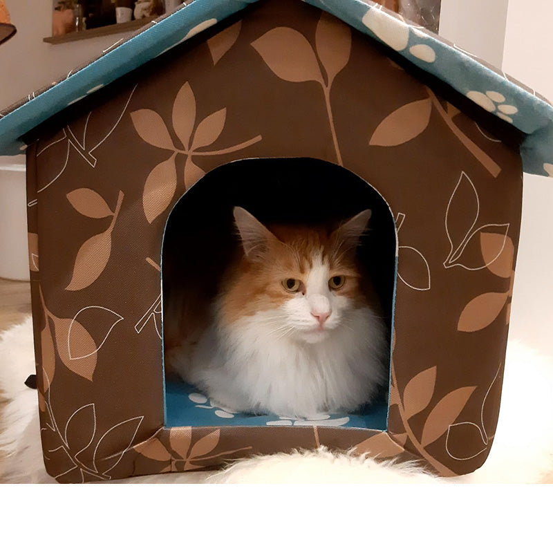 Feral cat outdoor shelter, insulated with a self-warming pad for chilly nights.