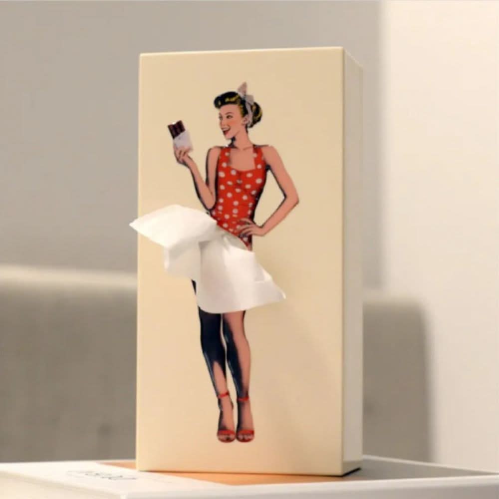 Plastic whimsical tissue holder, an imaginative home decor organizer for bedrooms and offices.