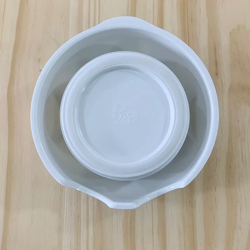 Charming ceramic pet bowl with an adorable dog graphic, ideal for daily dog food or water. Resilient and cute.