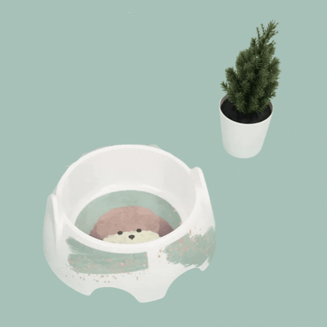 Heavy-duty ceramic dog bowl featuring a whimsical dog design, great for pet food or water. Non-slip base.