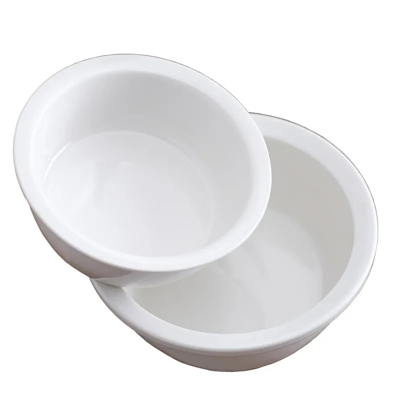 Durable white ceramic pet bowl, an essential pet supply for feeding your dog or cat.