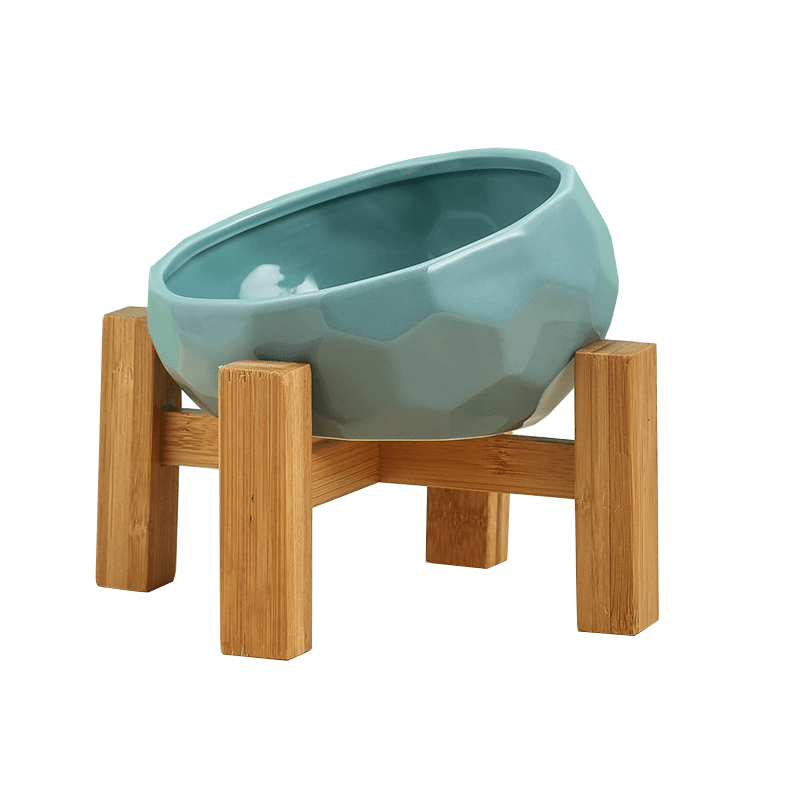 A stack of three ceramic pet food bowls, showing their compact and hygienic design