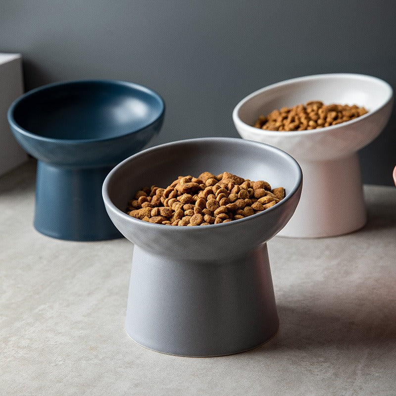 White ceramic tilted cat bowl, Nordic style, promoting healthy digestion with elevated design