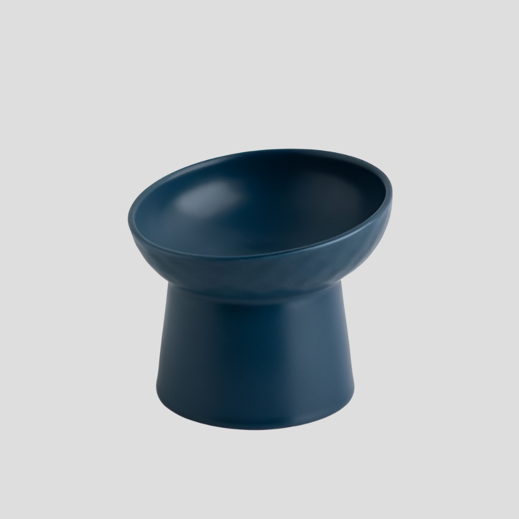 Stylish white tilted ceramic pet feeder, designed for cats to reduce neck strain while eating