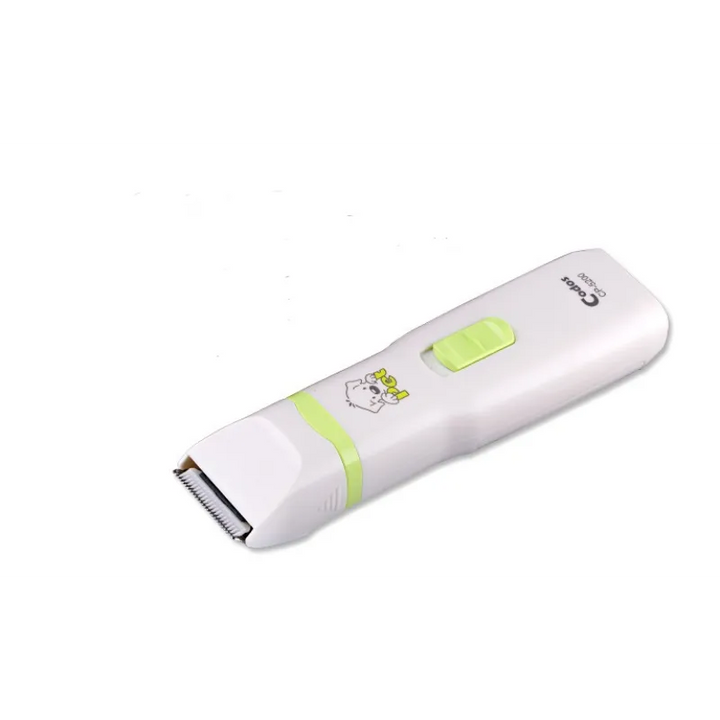 Close-up of white electric pet clippers from a grooming set, essential for animal care.