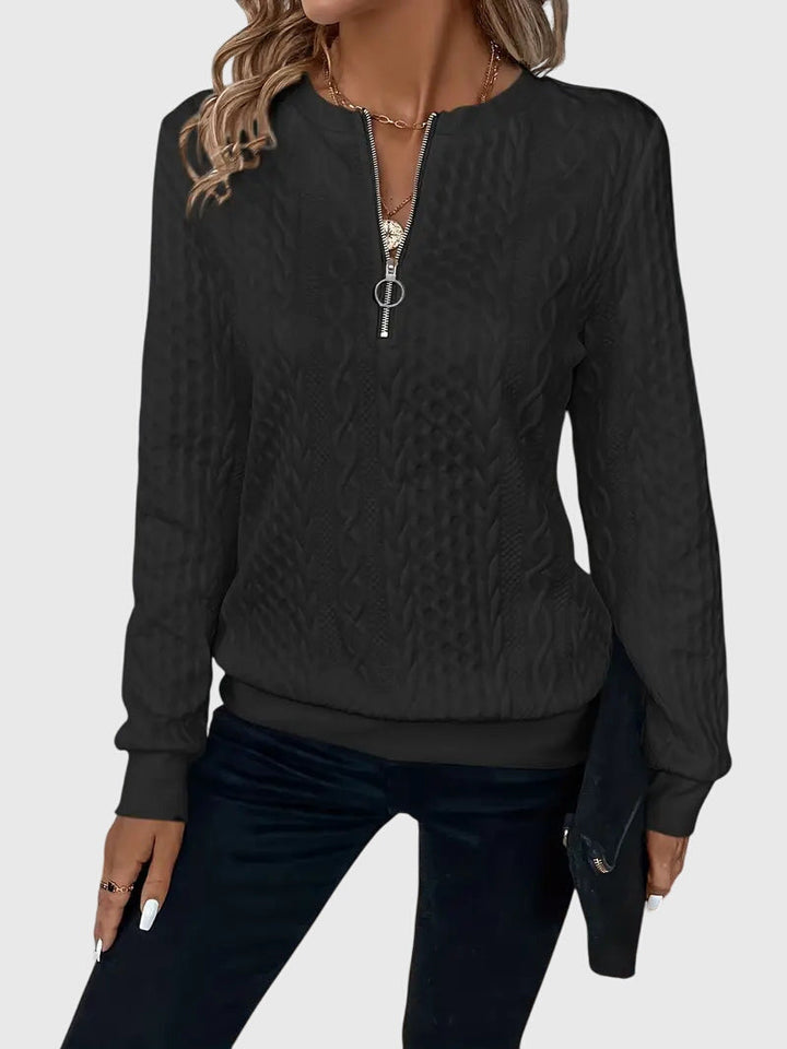 Blue women's Harlow cable knit quarter-zip sweater. Fashionable pullover, perfect for casual comfort.