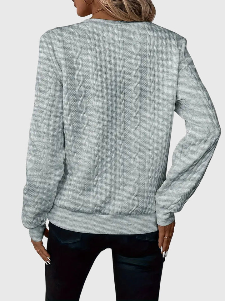 Black Harlow cable knit quarter-zip sweater styled with jeans. Chic women's everyday pullover.