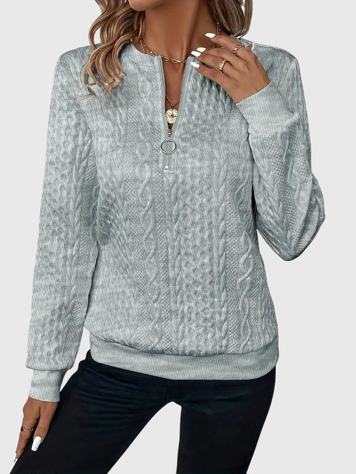 Blue Harlow cable knit quarter-zip sweater, perfect for women's fall casual style.